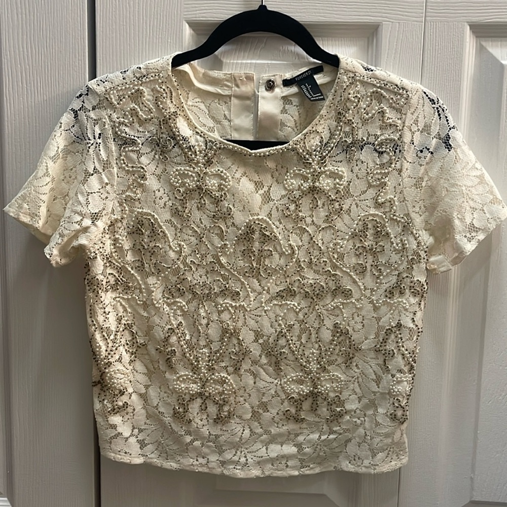 Forever 21 cream embellished with pearls and beads made out of lace material